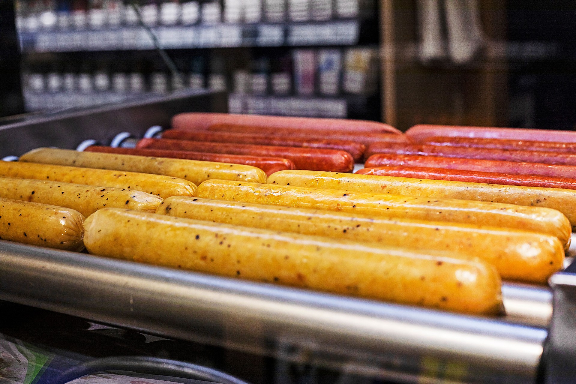 cook sausages for hot dogs at the gas station, horizontal