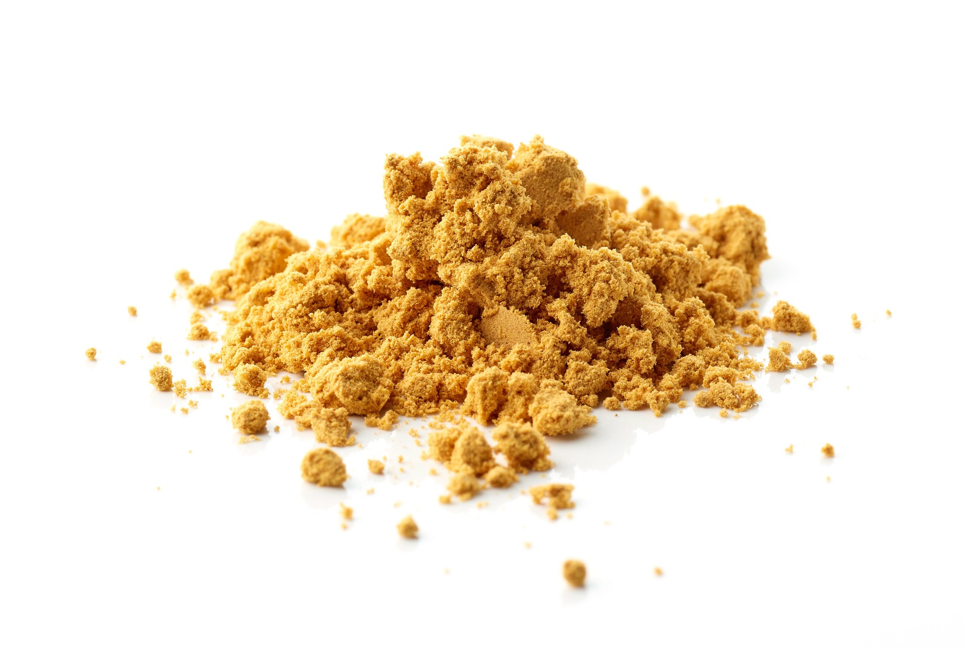 heap of dried wild rosehip fruit powder macro isolated on white background, selective focus
